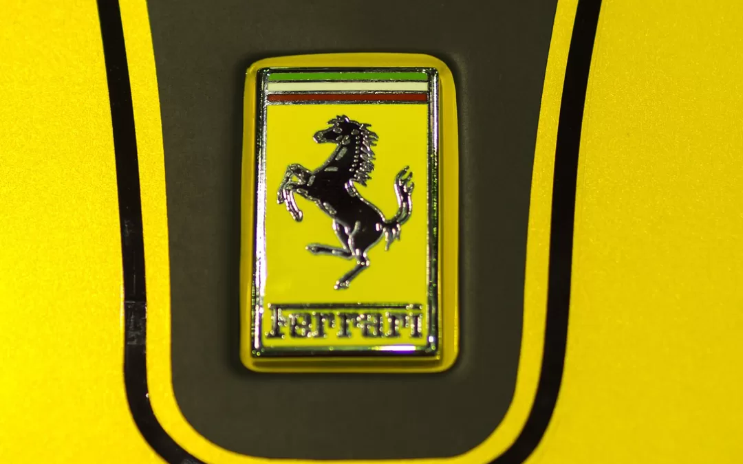 Which luxury automobile does not feature an animal in its official logo?
