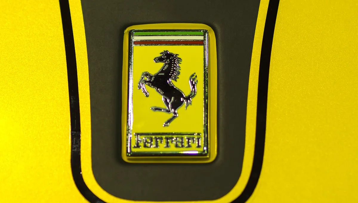 Which luxury automobile does not feature an animal in its official logo?